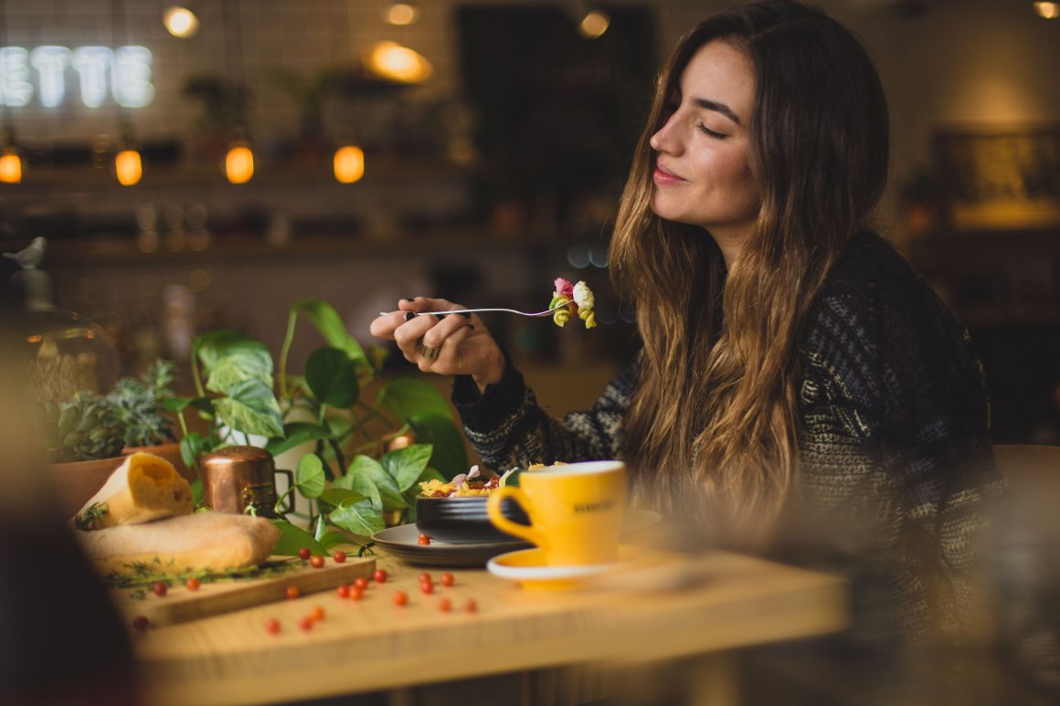 Girl eating in a cafe
