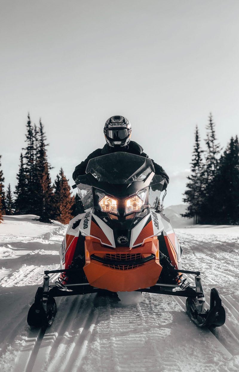 Frontward view of a rider on a snowmobile