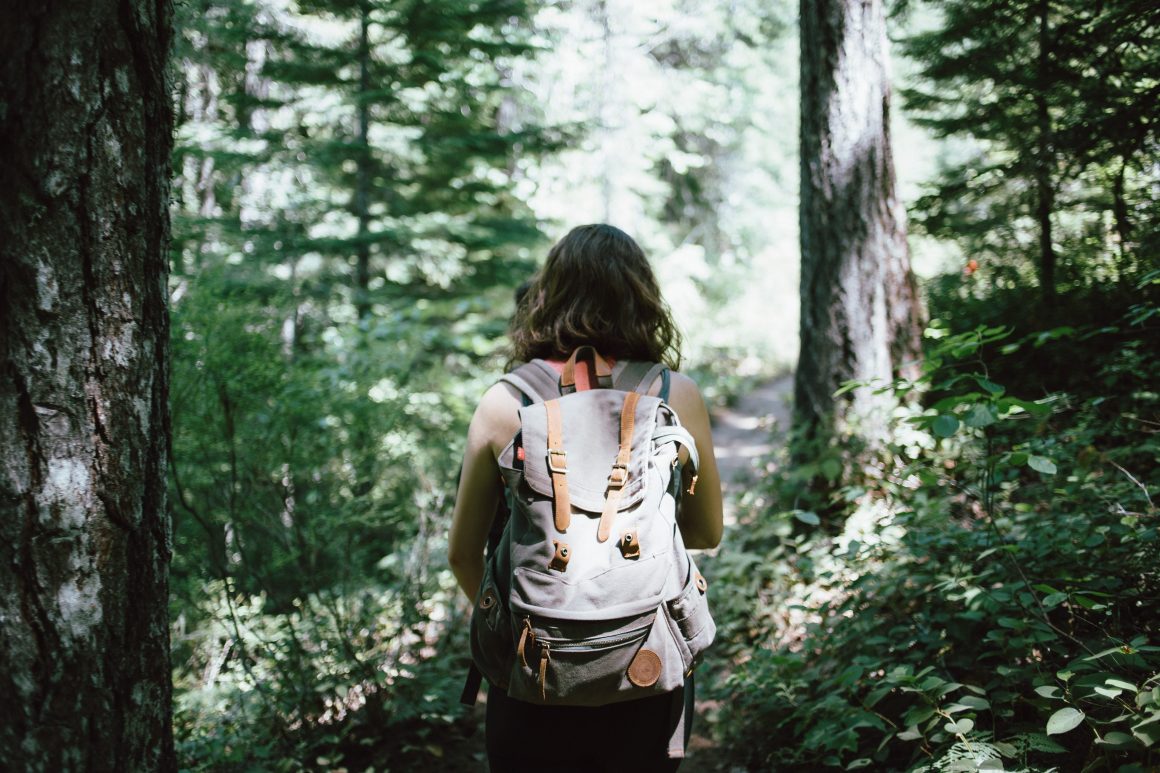Girl hiking in forest